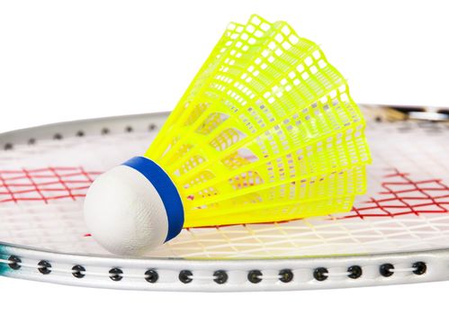 Shuttlecock lying on the badminton racket isolated on white background