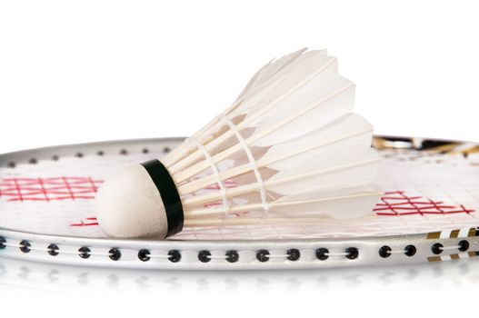 Shuttlecock On Badminton Racket Isolated On White Background