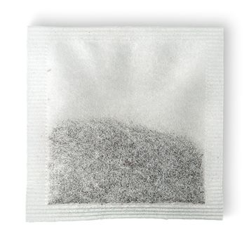 Single tea bag horizontally isolated on white background