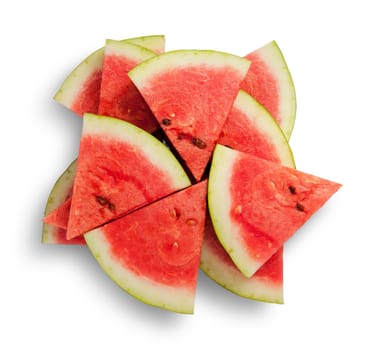 Slices of watermelon in a chaotic stack isolated on white background