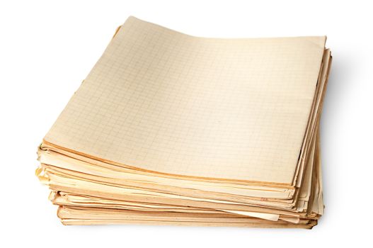 Stack of old yellowed sheets of school notebooks top view isolated on white background