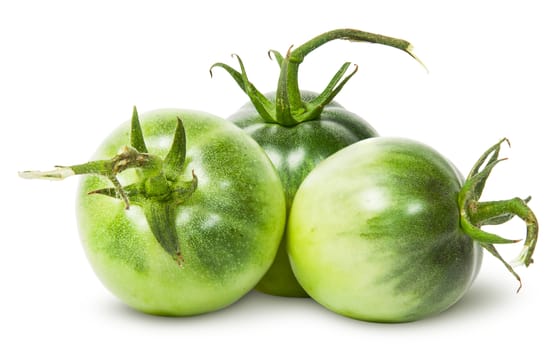 Three green tomatoes near isolated on white background