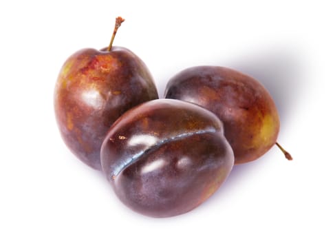 Three violet plums top view isolated on white background