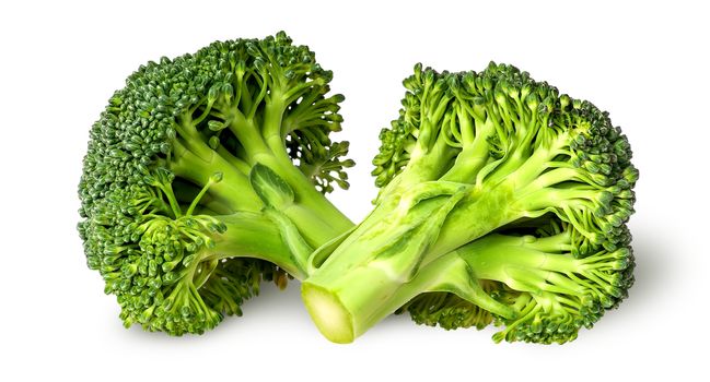 Two broccoli florets beside isolated on white background