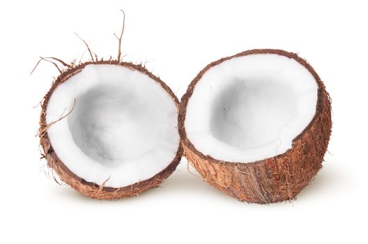 Two halves of coconut lying next isolated on white background