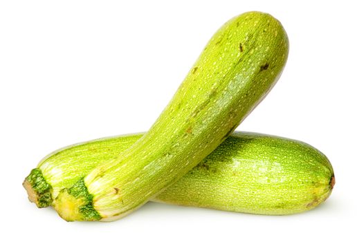 Two fresh courgette crisscross isolated on white background