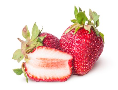 Two freshly whole and half strawberries isolated on white background