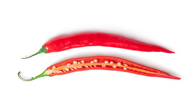 Two inverted halves of red chili peppers isolated on white background