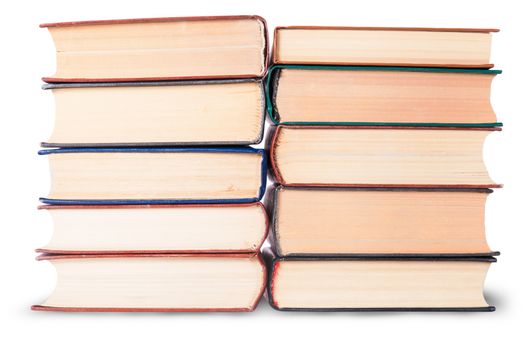 Two stacks of old books isolated on white background