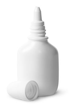 White nasal spray cap beside isolated on white background