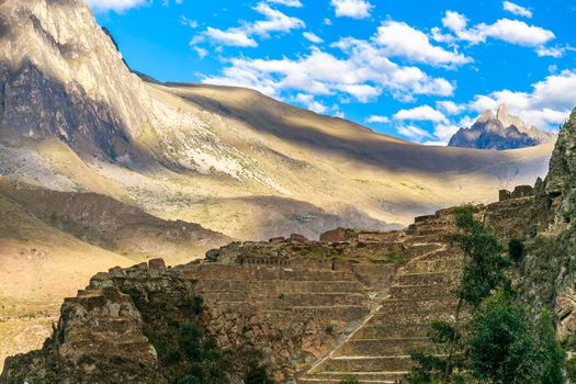Terraces of Pumatallis, ancient Inca fortress and mountains, Sacred Valley, Ollantaytambo, Peru