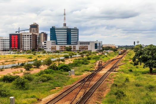 Railroad and rapidly developing central business district, Gaborone, Botswana, Africa, 2017
