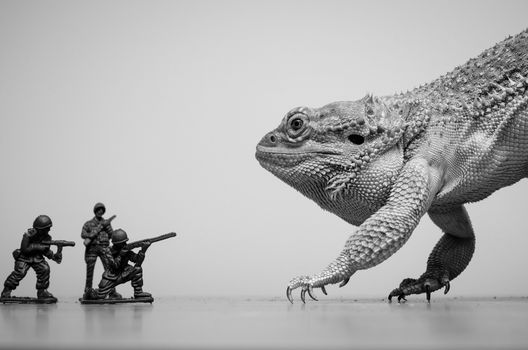 bearded dragon monster attacked by plastic soldiers