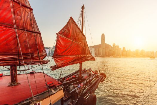 Sailboat In Hong Kong Harbour at sunset.