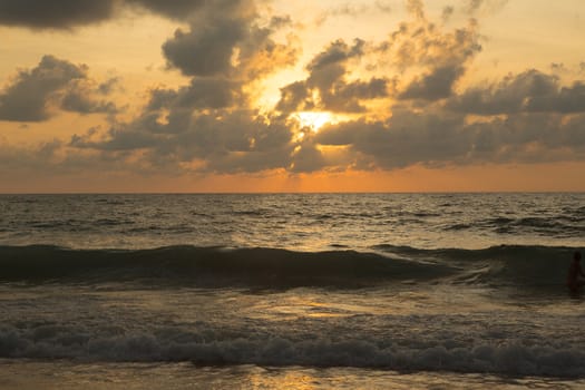 a beautiful sunset in the sea on the beach