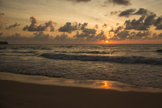 a beautiful sunset in the sea on the beach