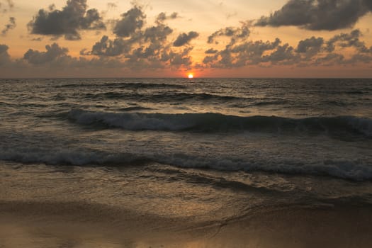 a beautiful sunset in the sea on the beach