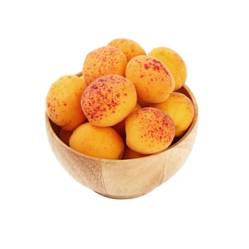 Mellow ripe fresh apricots with in small wooden bowl isolated on white background, close up, high angle view