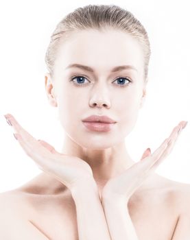Portrait of young woman with perfect skin and big lips holding hands near face