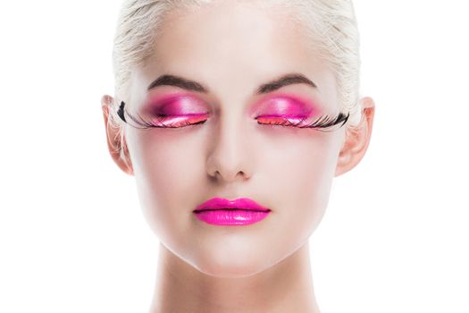 Portrait of young woman with fancy pink make-up isolated on white background