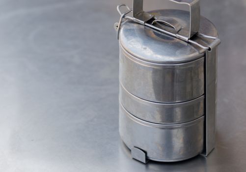 COLOR PHOTO OF OLD STAINLESS STEEL LUNCH BOX