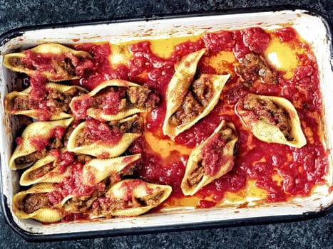 close up of rustic italian stuffed conchiglie pasta