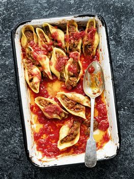 close up of rustic italian stuffed conchiglie pasta