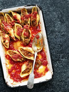 close up of rustic italian stuffed conchiglie pasta