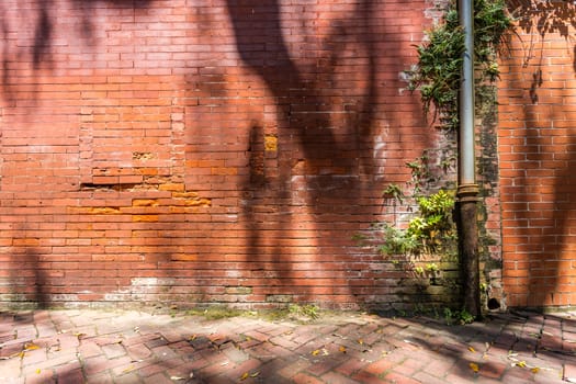 An old brick wall in the downtown historic district of Savannah, Georgia
