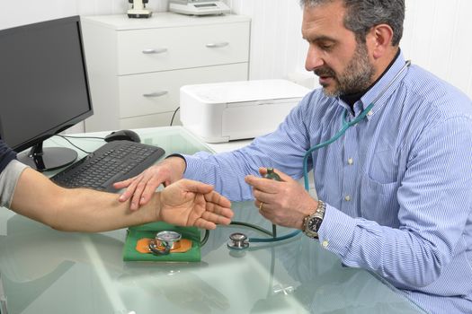 Doctor and patient with blood pressure meter in Doctor's office.