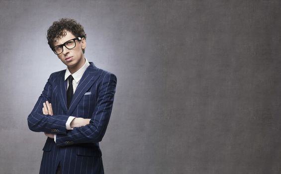 Portrait of a young businessman thinking and looking up