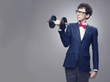 Funny skinny man lifting weights and look proud about it