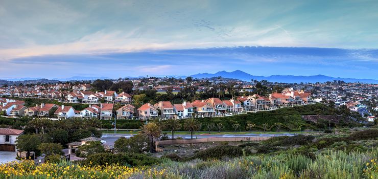 Panoramic view of tract homes along the Dana Point coast at sunset in Southern California, USA