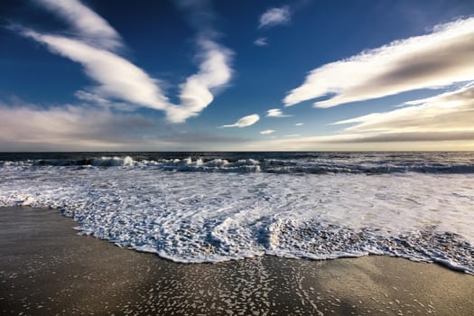 Beautiful scenery on the sea shore, the waves and sunset