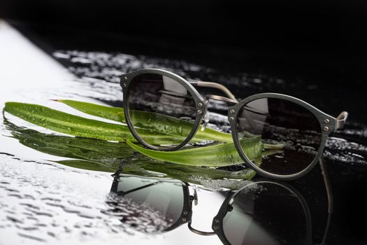 Sunglasses on a studio glass background