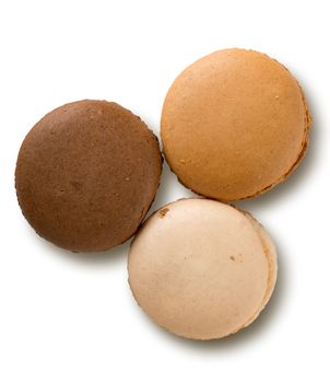 Caramel macarons isolated on a white background