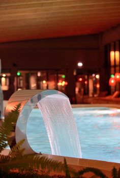 Relaxation pool in spa with waterfall