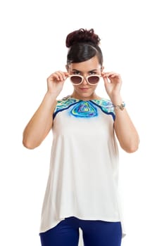 the young woman in sunglasses and in convenient clothes on a white background