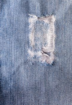 Jeans close-up, texture, torn, mopped pieces
