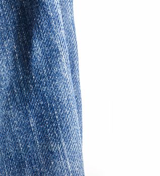 Jeans texture close-up, isolated on white background.