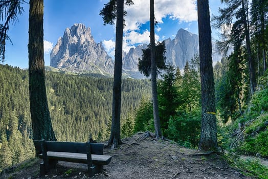 Bench and beautiful mountains panorama of Sassolungo Group, Dolomiti - Trentino-Alto Adige, Italy