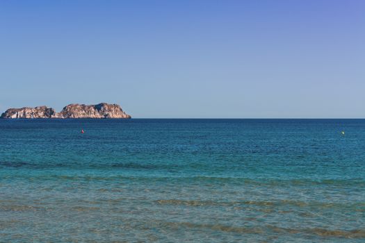 Views of the Bay of Paguera with a sandy beach and azure waters, Mallorca, Spain.