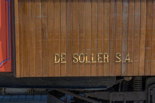 Lettering the vintage train, tram on the beach promenade of the town of Soller in Spain.