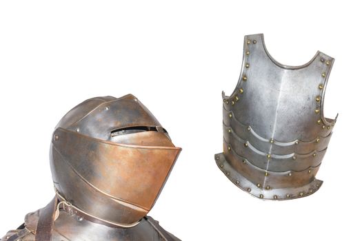 An antique European armor with helmet and breastplate isolated against white background.
