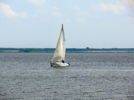 a Sailingboat on a lake at sunny day, Ukraine