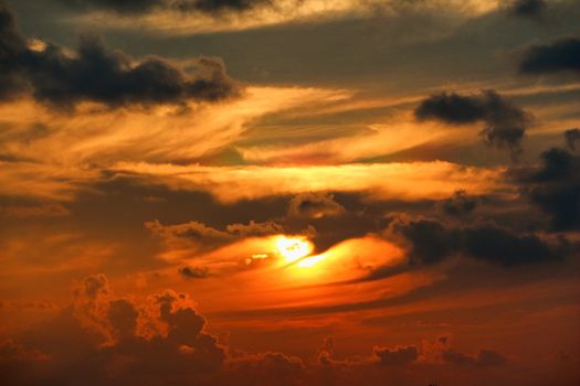 a dark silhouette clouds on sky at sunset, tropical island in Maldives Islands