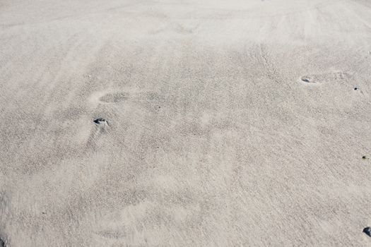 Natural background of sand on the shore of the black sea