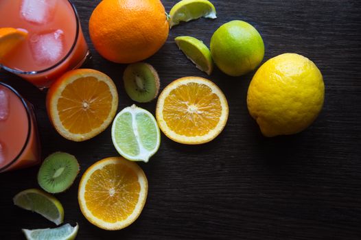 Fresh juice with fruits on wooden table