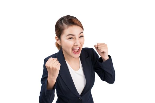 Close-up of an excited businesswoman celebrating with arms up