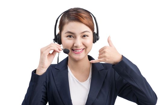 Portrait of beautiful young asian female customer service representative in headset looking at camera and smiling while isolated on white
